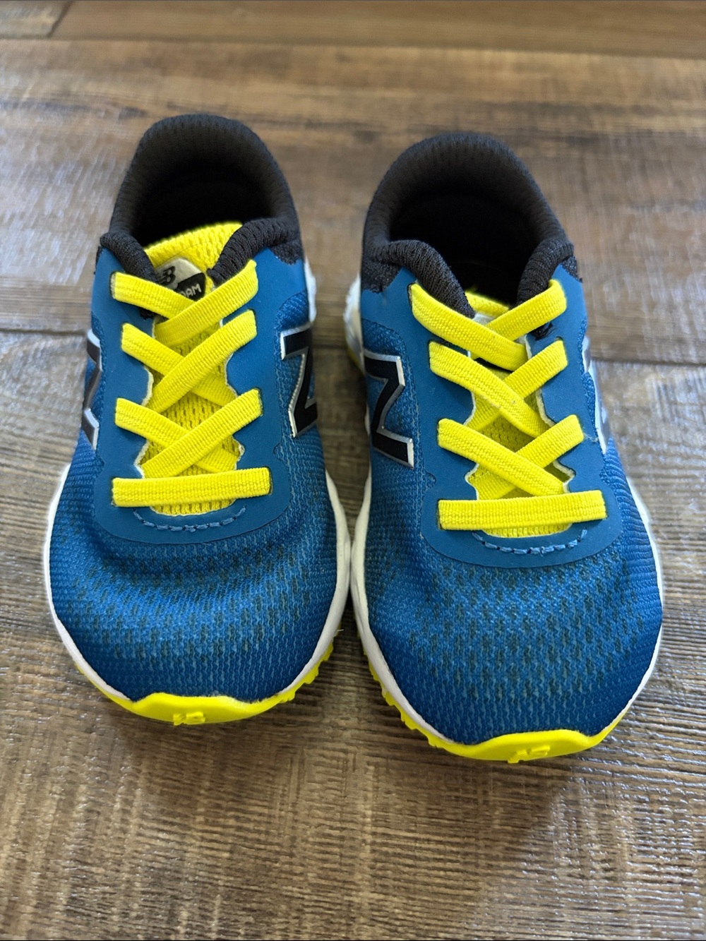New Balance Kids Blue Sneakers with Yellow Accents